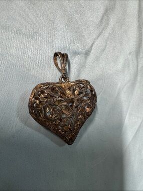 Vintage, carved open filigree sterling silver puffy heart charm pendant.